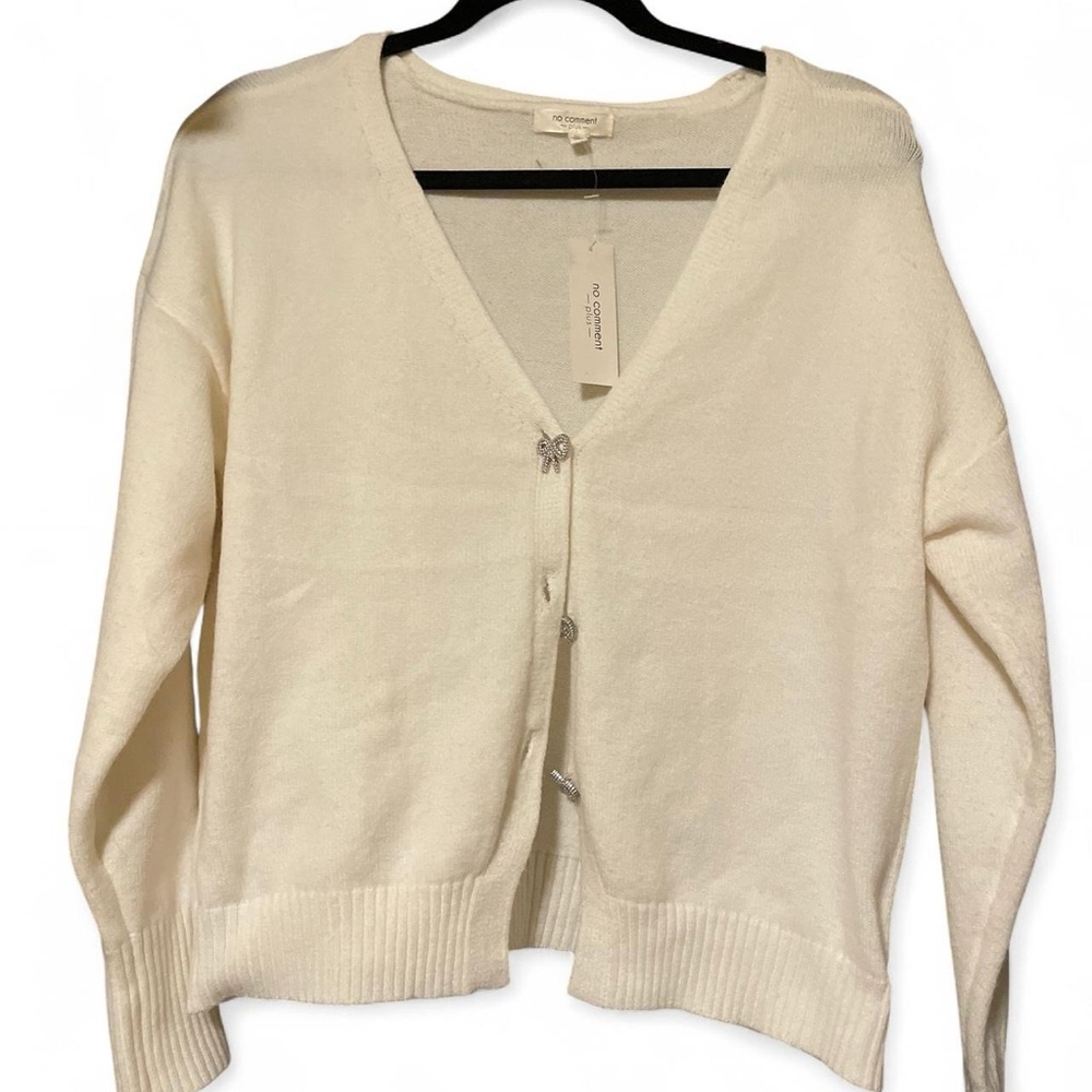 Elegant Cream Cardigan by [No Comment]
